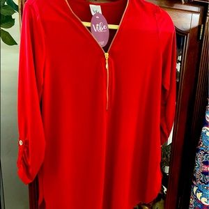 Cute red top with roll up sleeves.
